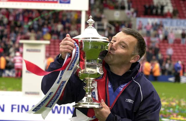 Dave Penney celebrates guiding Doncaster Rovers back to the Football League in 2003.