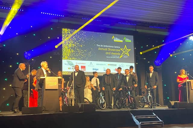 Chloe Maxfield presented with her prize of a Halfords bicycle at The Air Ambulance Service Annual Showcase and Awards at The Vox in Birmingham on September 17.