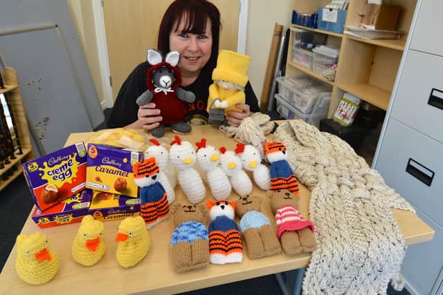 Karen with her knitted creations
