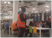 Workers at Doncaster's Amazon depot stage a sit in protest. (Photo: Taj Ali/Twitter).