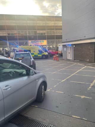 Emergency services attend to a n injured person outside Boyes in Doncaster.