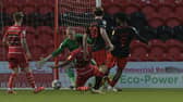 Ellis Harrison slots in to put Fleetwood ahead. Picture: Howard Roe/AHPIX