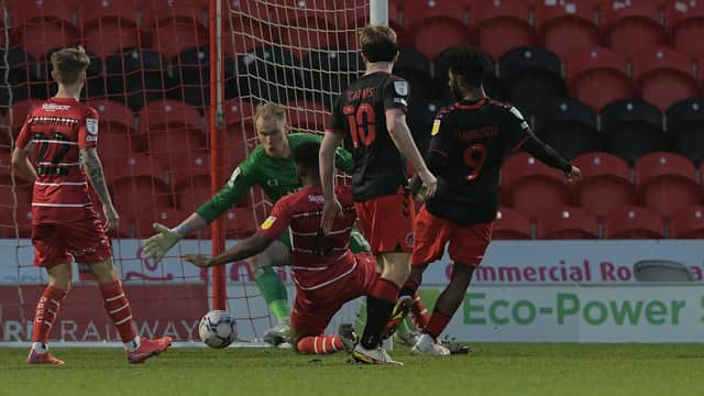 Ellis Harrison slots in to put Fleetwood ahead. Picture: Howard Roe/AHPIX