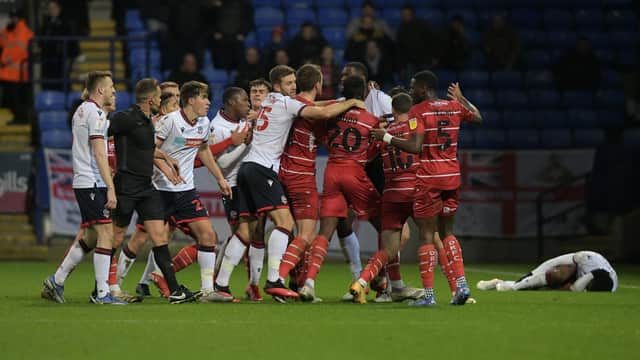 The melee which followed Joseph Olowu's challenge which led to his dismissal at Bolton Wanderers