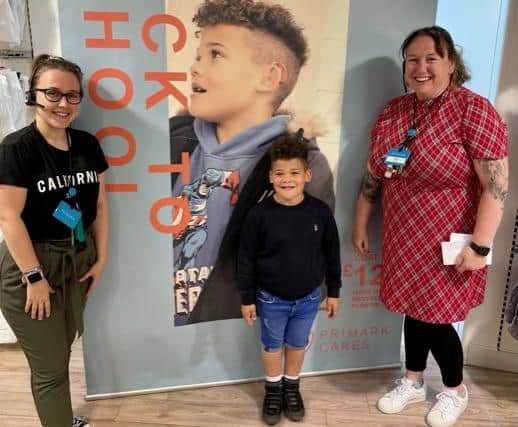Seb with his photo in Primark.