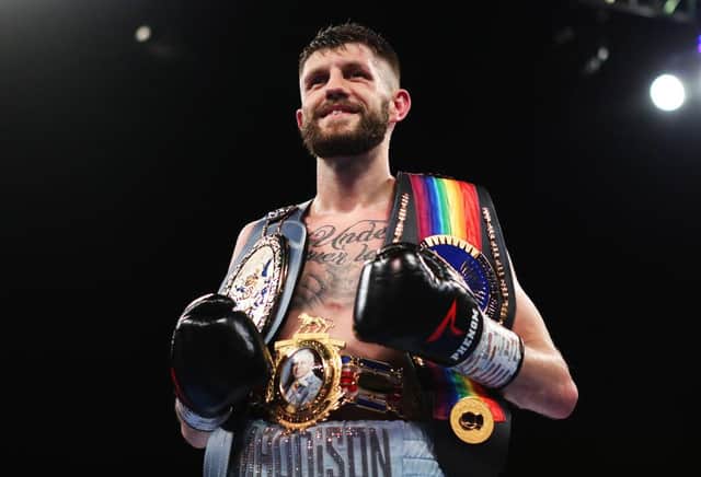 Jason Cunningham celebrates after winning the British and Commonwealth super bantamweight title to add to his European title