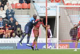 Wycombe's Ade Akinfenwa heads home Wycombe's second. Photo: Howard Roe/AHPIX LTD