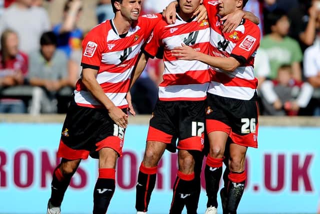 Mark Wilson (left) and James Coppinger (right) celebrate with Martin Woods