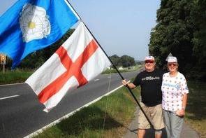 Avid fans Geoff and Jill Telford from Doncaster are seen proudly flying the Yorkshire flag in support of the riders. Geoff and Jill have been following much of the race and were in Goole yesterday for stage 3 and were heading towards Western Super Mare to pick up stage 7 later in the week. Pic: Mick Hickman Photography