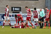 Welcome back: Andy Butler down injured after a kick to the ankle in his first league game back for Rovers in December at Northampton. Picture: Andrew Roe/AHPIX