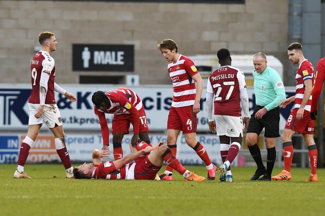 Welcome back: Andy Butler down injured after a kick to the ankle in his first league game back for Rovers in December at Northampton. Picture: Andrew Roe/AHPIX