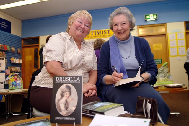 Writer Joan Stephenson signs a copy of her novel Drusilla for Ann Hodgson from Chesterfield in 2008
