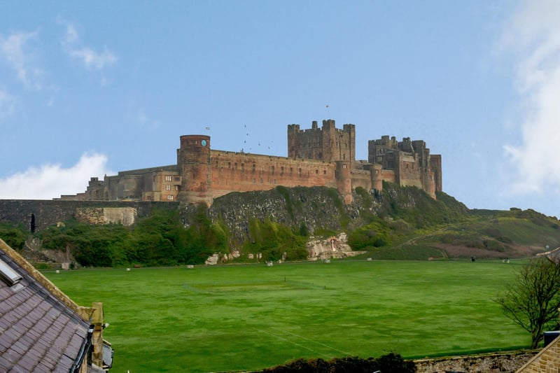 The view across the village green to Bamburgh Castle.