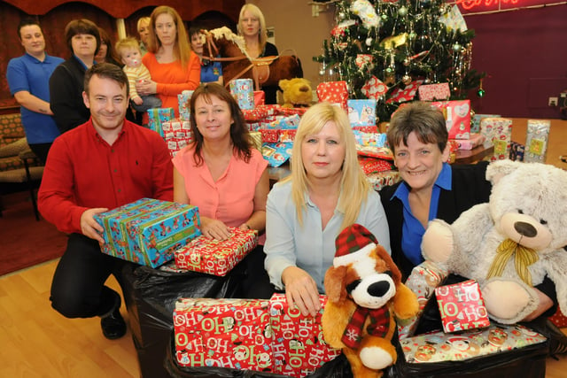 Okay so it's months away but that doesn't mean we can't reminisce on Christmases past. Crown Bingo owner Rob Garrard, left, and manager Maria Burrell, right, hand over Christmas gifts to Angie Allen and Kathryn McClafferty of People for Places. Remember this?