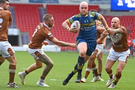 Dons’ Liam Johnson breaks through to score a try in the win over Hunslet. Photo: Andrew Roe/AHPIX LTD