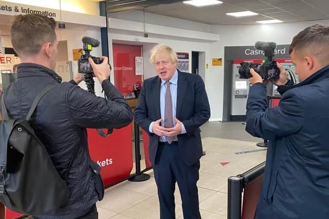 Prime Minister Boris Johnson stops for a few photographs
