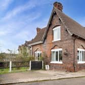The appealing frontage of the 19th century cottage that is for sale at £140,000.