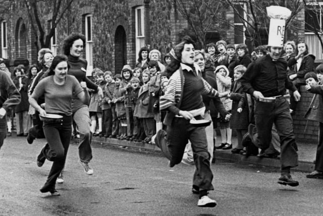 Do you recognise anyone in this picture of a pancake race on The Avenue at Ironville? Can you tell us the year  when it was taken?