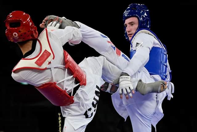 Bradly Sinden (blue) in action at Tokyo 2020. Photo by JAVIER SORIANO/AFP via Getty Images