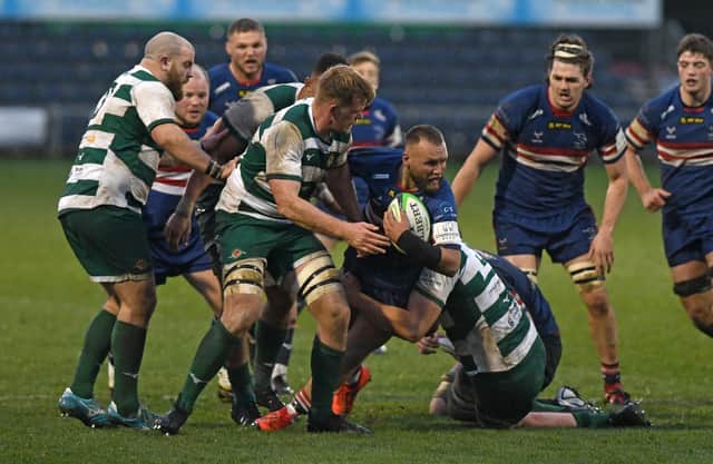 Doncaster Knights and Ealing Trailfinders, pictured battling it out on the pitch, are fighting it out for the Championship title and also the right to be promoted to the Premiership.