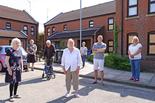 Concerned residents pictured outside their homes on Wheatfields, Thorne. Pictured l-r Maureen Cragg, Keith Ridsdale, David Purdy, Patricia Stafford, Janice Taylor, Jeff Budworth and Paula Shaw. Picture: NDFP-08-06-21-Wheatfields 1-NMSY