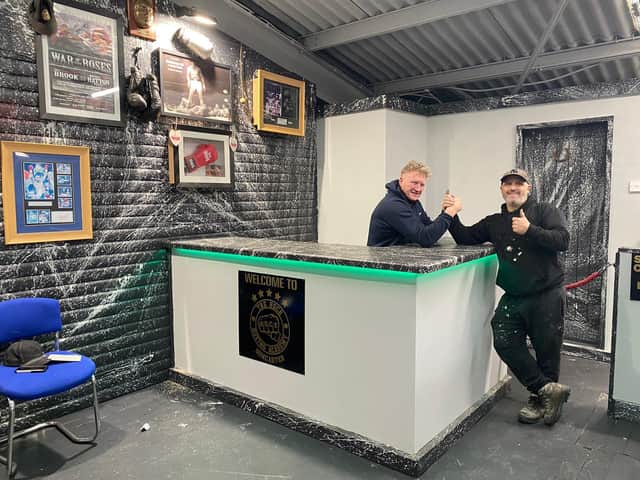 From left; boxing coach Kev Burton with parent Abie Marshall at the new boxing club club in Marshgate.