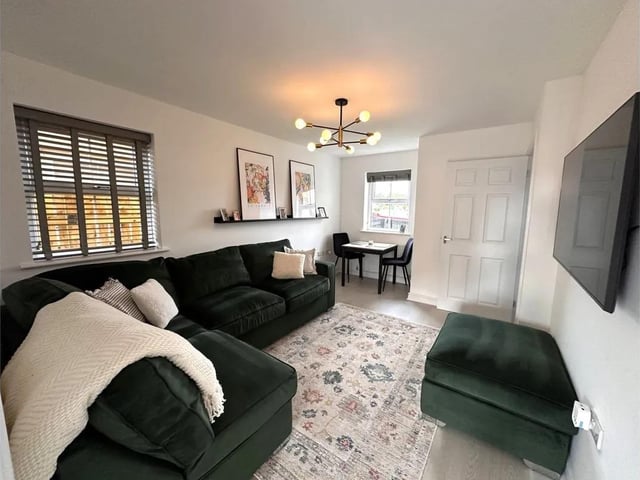 Watch the boats go by from this spacious sitting room.