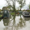 Reflection of trees on the water of the canal.
