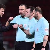 Andy Butler speaks to the officials after the defeat to Crewe. Photo: Nathan Stirk/Getty Images