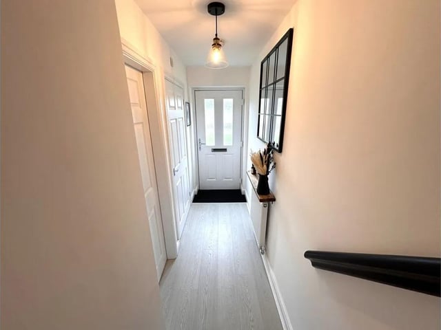 The hallway, with staircase leading up.