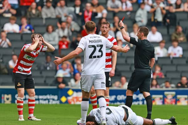 Harry Clifton is sent off by Referee Simon Mather.