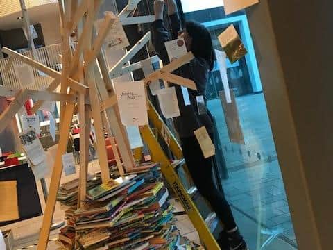 Artist Sacha Gray putting the tree together.