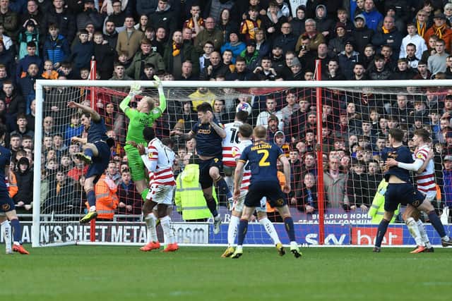 Bradford City's Andy Cook scores the decisive goal in his team's win over Doncaster Rovers.