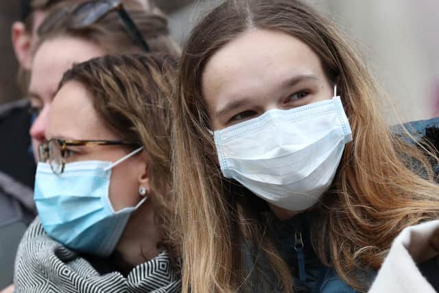 People wearing face masks amid concern about the spread of coronavirus. Picture by Jonathan Brady/PA Wire.