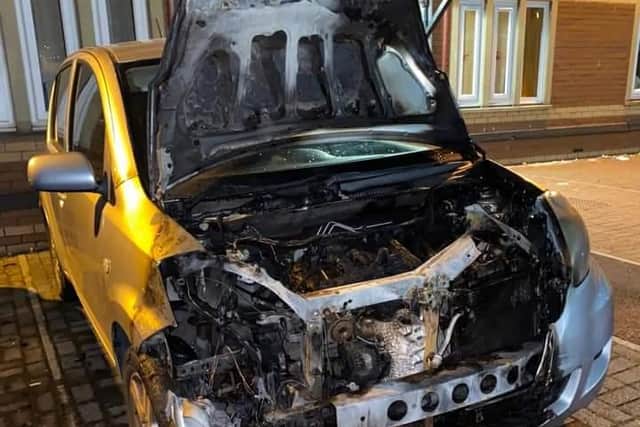 One of two cars set on fire at a Doncster flats complex.
