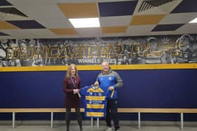 Cathy Hinde, DCLT Head of Marketing and Business Development with Carl Hall, Chief Executive of the Dons.