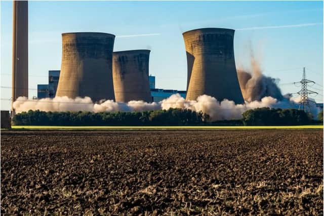The Eggborough towers come crashing down in a controlled explosion this morning. (Photo: James Hardisty).