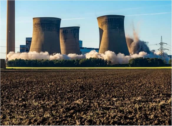 The Eggborough towers come crashing down in a controlled explosion this morning. (Photo: James Hardisty).