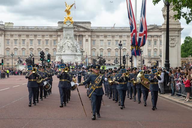 The Queen's Colour Squadron and Central Band of the Royal Air Force performing Changing of the Guard at Buckingham Palace
