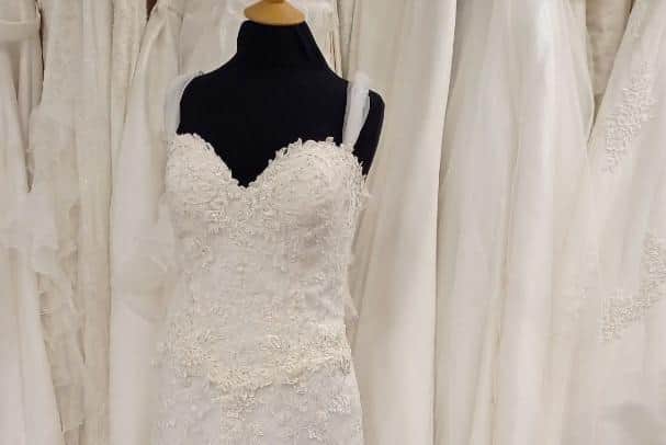 Size 12, ivory, silk satin and lace, sequinned dress, with beautiful, beaded detail. Original price £1,000. 
