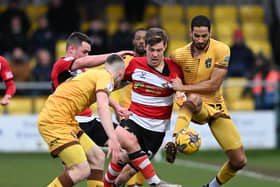 Joe Ironside's last-gasp penalty secured a valuable point for Rovers away at Sutton.