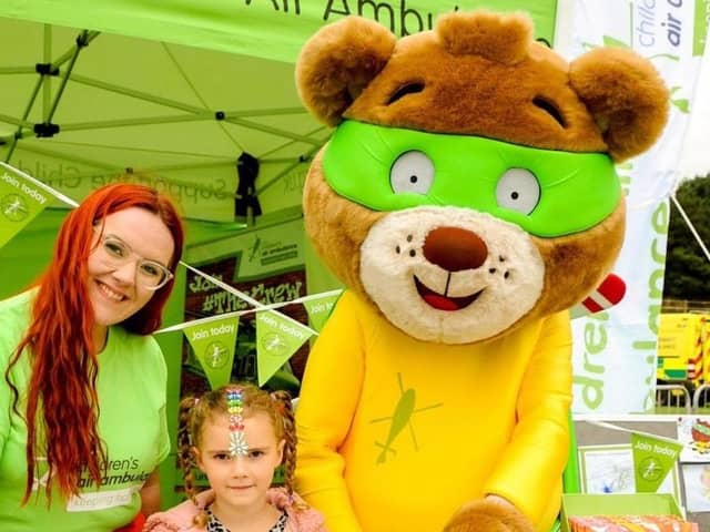 Children's Air Ambulance stand with Blade the mascot