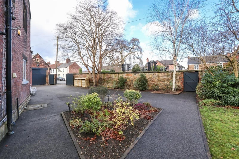 The Old Rectory occupies a private, gated plot measuring approximately 0.6 acres.