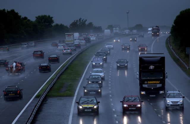 Traffic drives through heavy rain on the M5 (Photo by Matt Cardy/Getty Images)