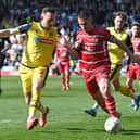 Tommy Rowe battles with Bolton's Gethin Jones. Picture: Andrew Roe/AHPIX LTD