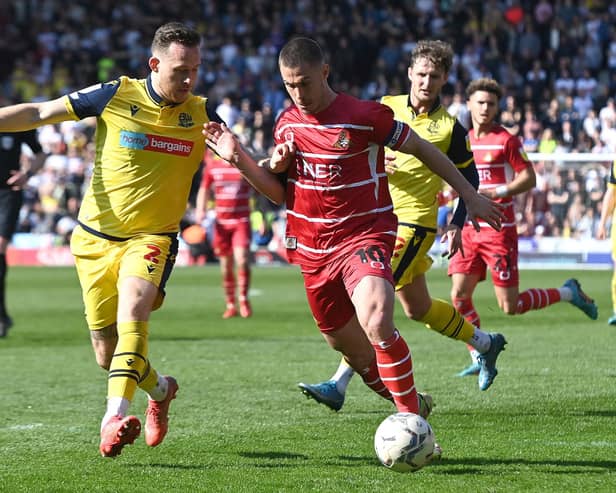 Tommy Rowe battles with Bolton's Gethin Jones. Picture: Andrew Roe/AHPIX LTD