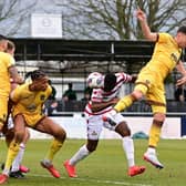 Joseph Olowu heads at goal.