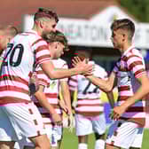 Josh Andrews, wearing the number 20 shirt, celebrates his goal against Nuneaton. Photo: Andrew Roe/AHPIX LTD
