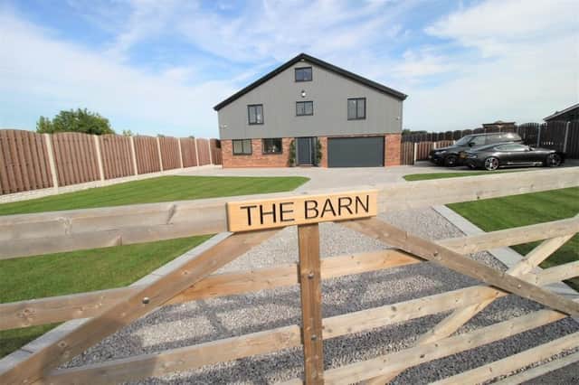 The approach to the four-bedroom barn conversion that is now for sale at £700,000.