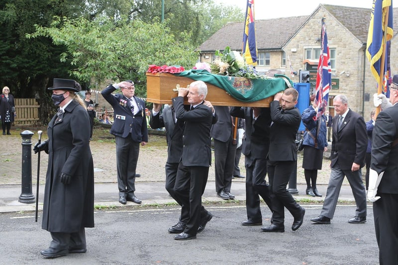 Salutes as Mr Eley's coffin is carried past the standard bearers
